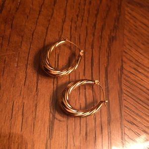 Gold coiled mini oval hoop earrings
